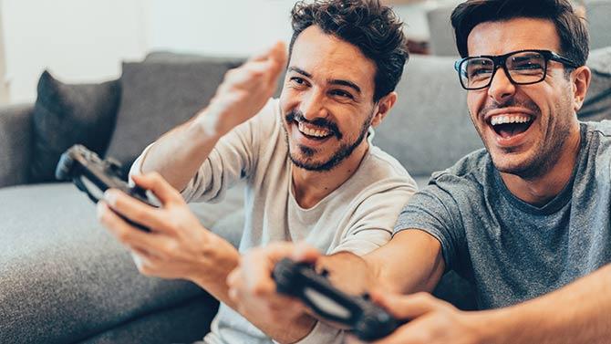 2 men playing video game